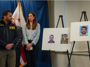 FBI Director Kash Patel (L) looks at photos of the two West Virginia National Guard soldiers shot in the nation's capital., along with the suspect in the shooting, in Washington, D.C., Thursday, Nov. 27, 2025. The two soldiers were shot blocks from the White House in what authorities are calling a targeted shooting.