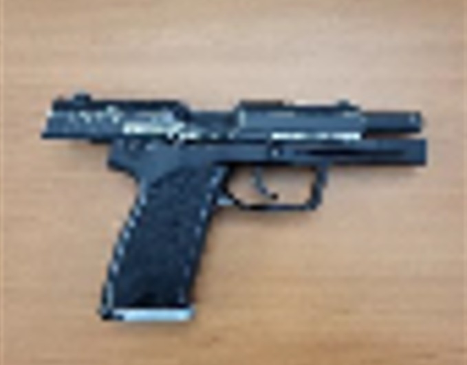  Niccoy St. John, 24, of Toronto, is charged and a replica firearm (seen here) has been seized but two others are still sought for an armed robbery at an entertainment lounge in Vaughan on Saturday, Oct. 22, 2025.