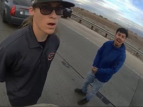 Valente Ayala (right) begs police for help after a suspect told an officer he shot a boy in the back seat during a traffic accident.