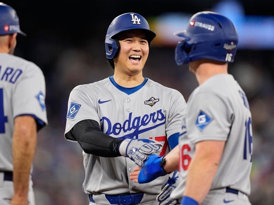 Shohei Ohtani and Will Smith of the Los Angeles Dodgers talk during the eighth inning of Game 6 of the Baseball World Series against the Toronto Blue Jays on Friday, Oct. 31, 2025, in Toronto.