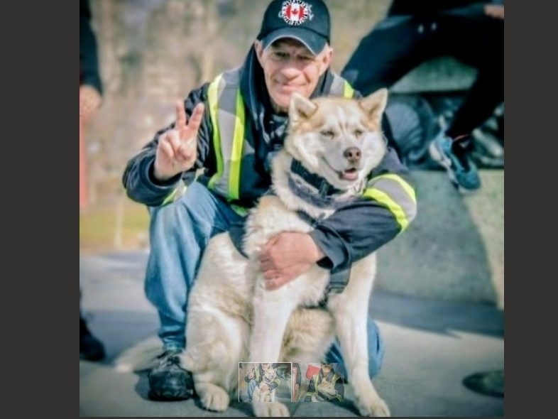  Scott Youmans is pictured with his medical service dog, Freedom