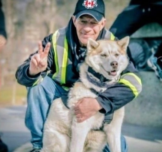  Scott Youmans is pictured with his medical service dog, Freedom