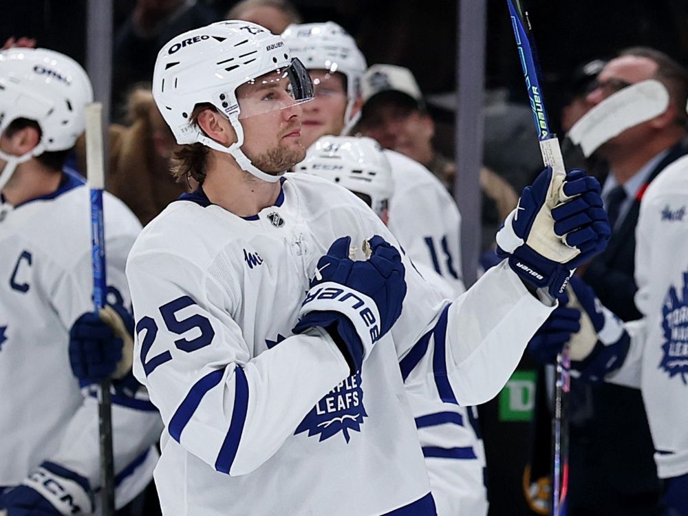 Brandon Carlo of the Toronto Maple Leafs is acknowledged by fans during the first period against the Boston Bruins.