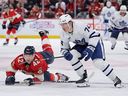 Bobby McMann of the Toronto Maple Leafs skates past Gustav Forsling of the Florida Panthers during Tuesday's game.