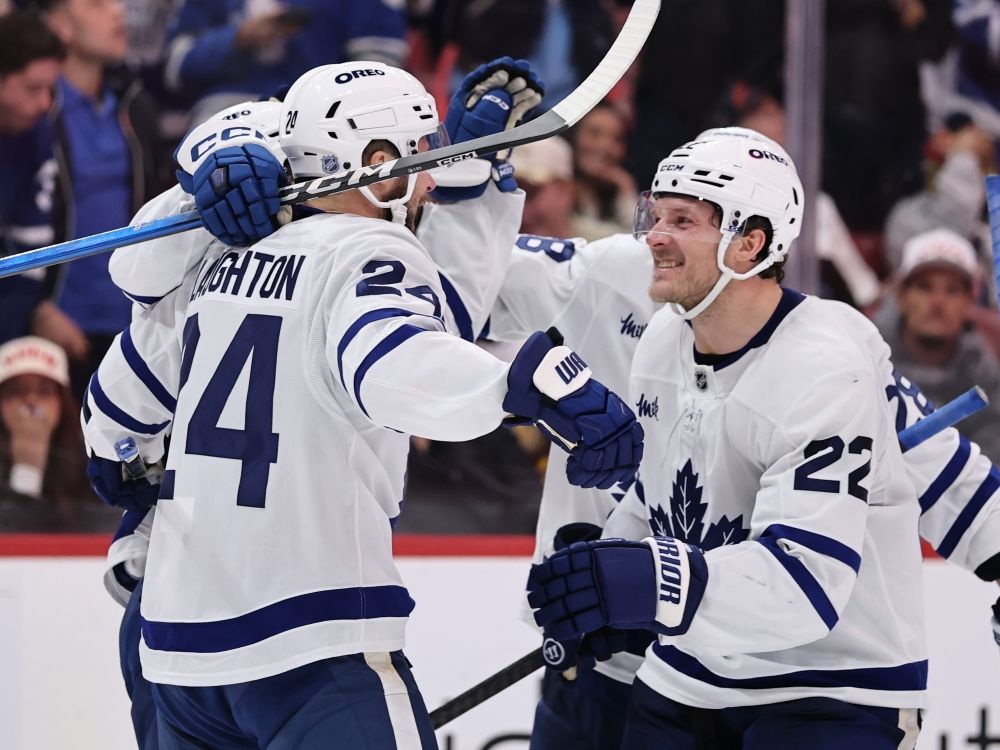 Scott Laughton of the Toronto Maple Leafs celebrates his goal with teammate Jake McCabe (right) against the Florida Panthers.