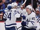 Scott Laughton of the Toronto Maple Leafs celebrates his goal with teammate Jake McCabe (right) against the Florida Panthers.