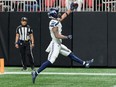 Seattle Seahawks wide receiver Jaxon Smith-Njigba reacts after scoring a touchdown against the Atlanta Falcons.