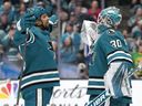 Goalie Yaroslav Askarov and Ryan Reaves of the San Jose Sharks celebrates defeating the Vancouver Canucks earlier this season.