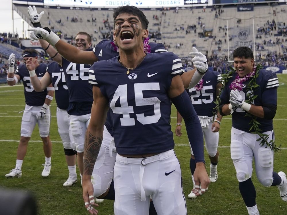 Former BYU wide receiver Samson Nacua and his teammates celebrate after a win against Idaho State in 2021.