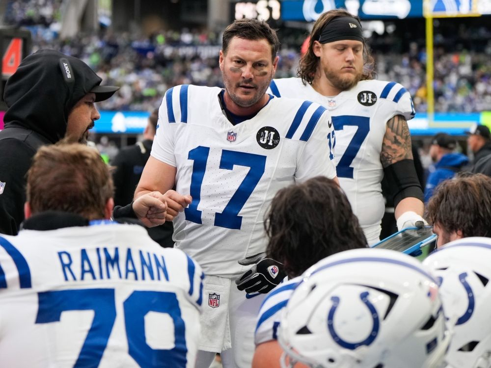 Indianapolis Colts quarterback Philip Rivers talks with teammates during the first half of last week's game against the Seattle Seahawks.