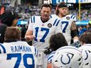 Indianapolis Colts quarterback Philip Rivers talks with teammates during the first half of last week's game against the Seattle Seahawks.