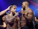 Jake Paul and Anthony Joshua face off during their ceremonial weigh-in ahead their fight in Miami on Friday night.