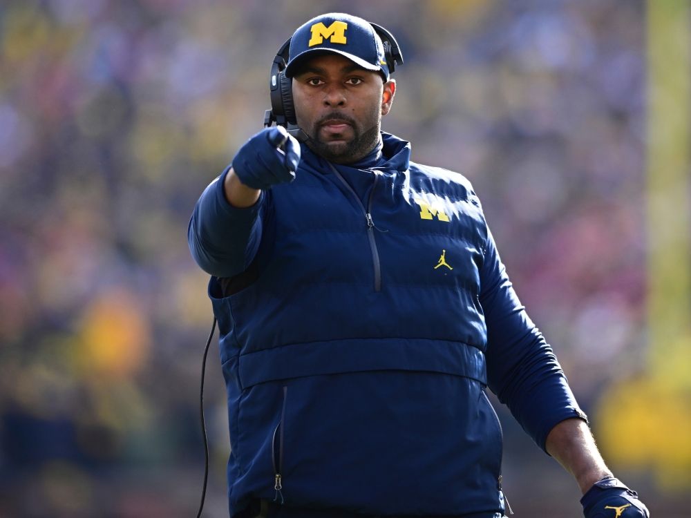 Michigan football coach Sherrone Moore reacts to a video replay during a game in 2023.