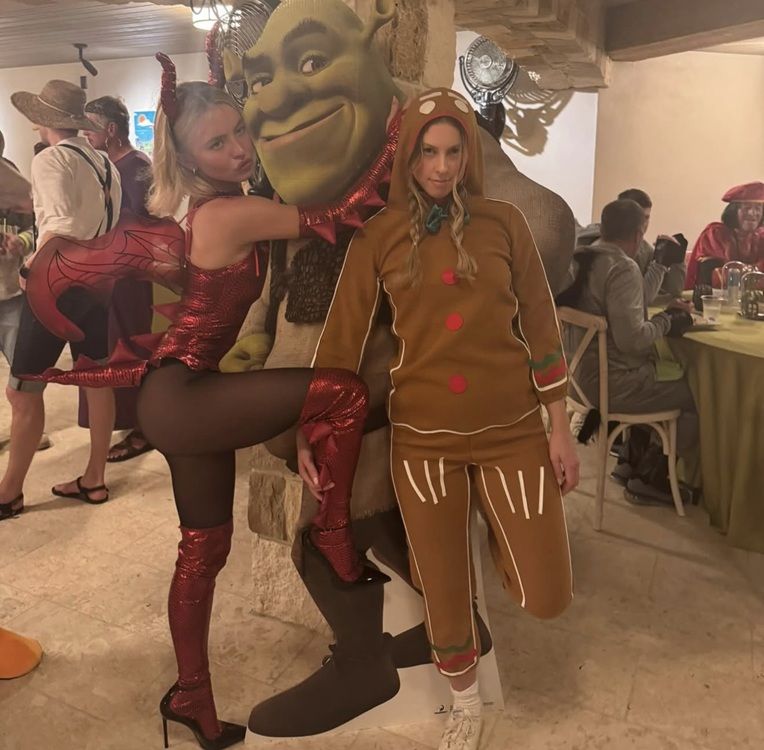Sydney Sweeney poses with someone dressed as the Gingerbread Man from Shrek. sydney_sweeney/INSGTAGRAM