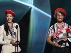 Jennifer Svedberg Yen (L) and Guillaume Broche, creators of the video game 'Clair Obscur: Expedition 33' along with the rest of their team attended the Game Awards wearing red berets from a character outfit available to players.