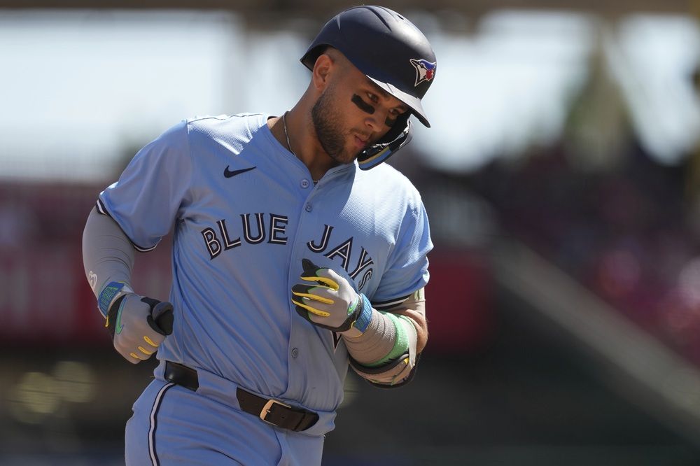 Blue Jays' Bo Bichette rounds third base after hitting a two-run home run in the ninth inning against the Cincinnati Reds, Monday, Sept. 1, 2025, in Cincinnati.