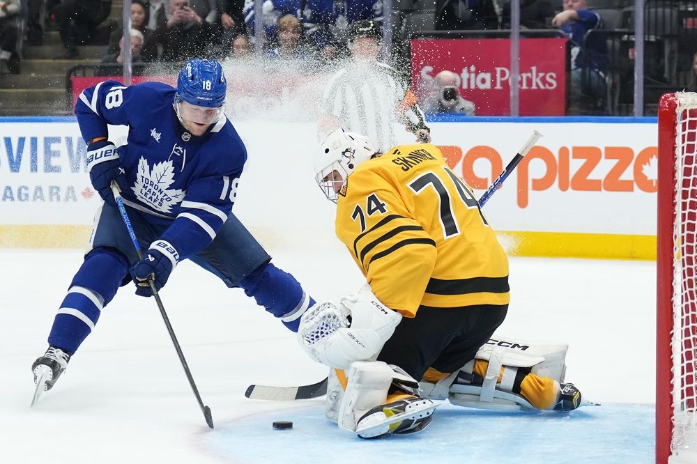 Maple Leafs forward Steven Lorentz scores past Pittsburgh Penguins goaltender Stuart Skinner during the second period in Toronto on Tuesday, Dec. 23, 2025. 
