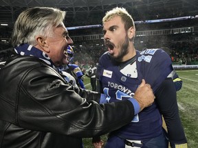 Toronto Argonauts quarterback Chad Kelly (12) celebrates with senior advisor Jim Barker after defeating the Winnipeg Blue Bombers in the 109th Grey Cup at Mosaic Stadium in Regina, Sunday, Nov. 20, 2022. THE CANADIAN PRESS/Frank Gunn