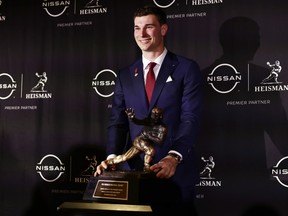 Indiana Hoosiers quarterback Fernando Mendoza poses with the Heisman Memorial Trophy at Marriott Marquis Hotel in New York City, Saturday, Dec. 13, 2025.