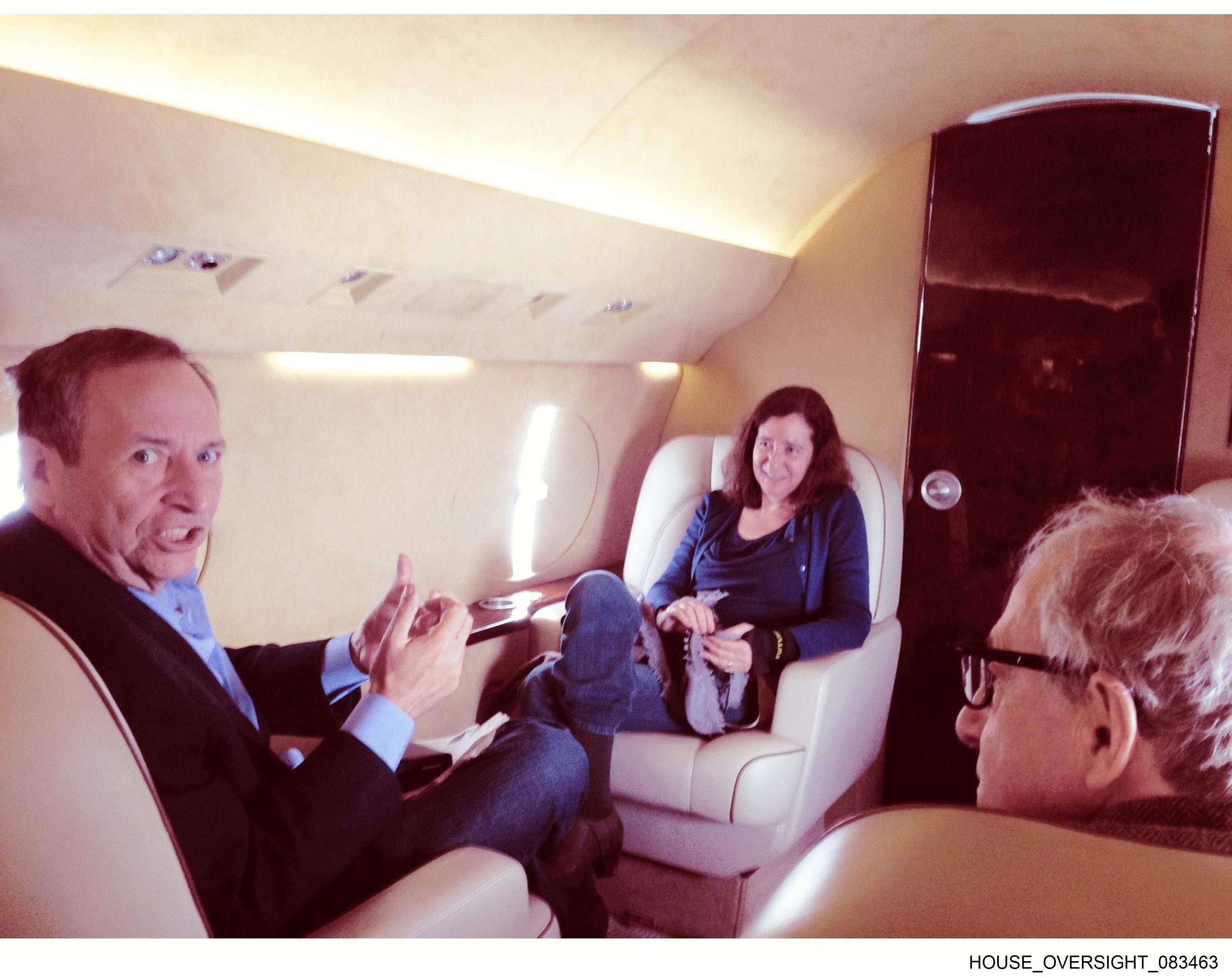  Larry Summers, left, his wife, Elisa New, centre, and Woody Allen on an airplane.
