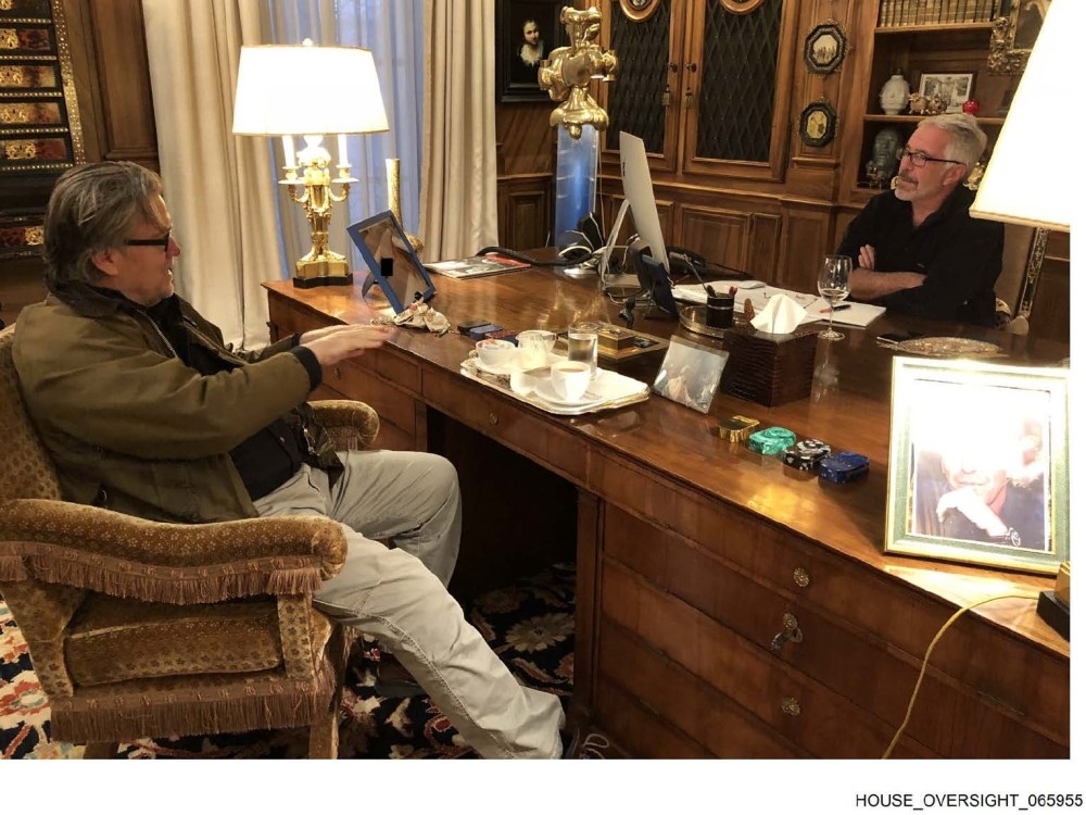  Democrats on the U.S. House Oversight Committee released dozens more images obtained from the estate of Jeffrey Epstein, Thursday, Dec. 18, 2025. Steven Bannon, the former presidential advisor to Donald Trump, is pictured sitting with Epstein in this undated photo.