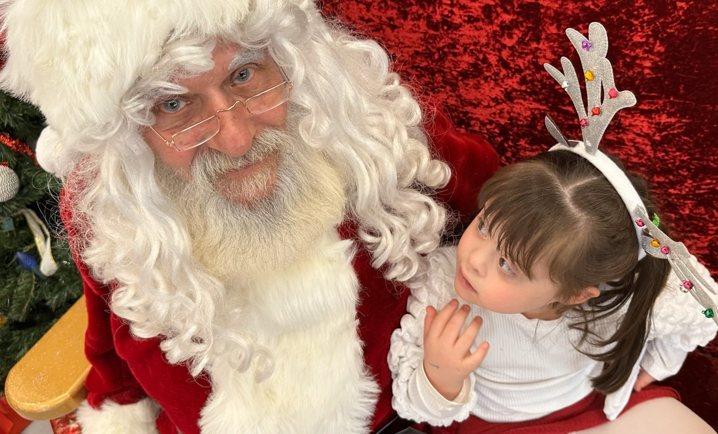  Ranee-Jessie Maxwell, 5, checks out Santa Claus at Variety Village Christmas party.