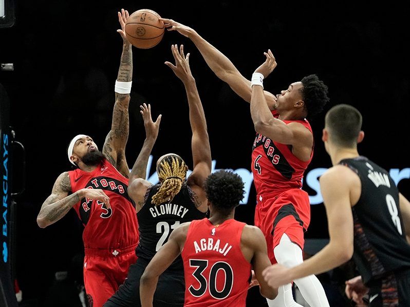 Toronto Raptors forward Scottie Barnes (4) blocks Brooklyn Nets forward Noah Clowney (21) during the first half on Sunday, Dec. 21, 2025, in New York. 