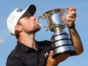 Rasmus Neergaard-Petersen of Denmark kisses the Stonehaven Cup after victory on day four of the Crown Australian Open 2025 at The Royal Melbourne Golf Club on Dec. 7, 2025 in Melbourne, Australia.