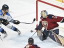 Sceptres' Ella Shelton (left) moves in on Victoire goaltender Ann-Renee Desbiens during third period PWHL action in Laval, Que., Dec. 7, 2025.