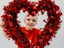 Chairkid Madison “Madi” Ambos says thanks with a heart wreath (NICO BALDONADO/Variety)