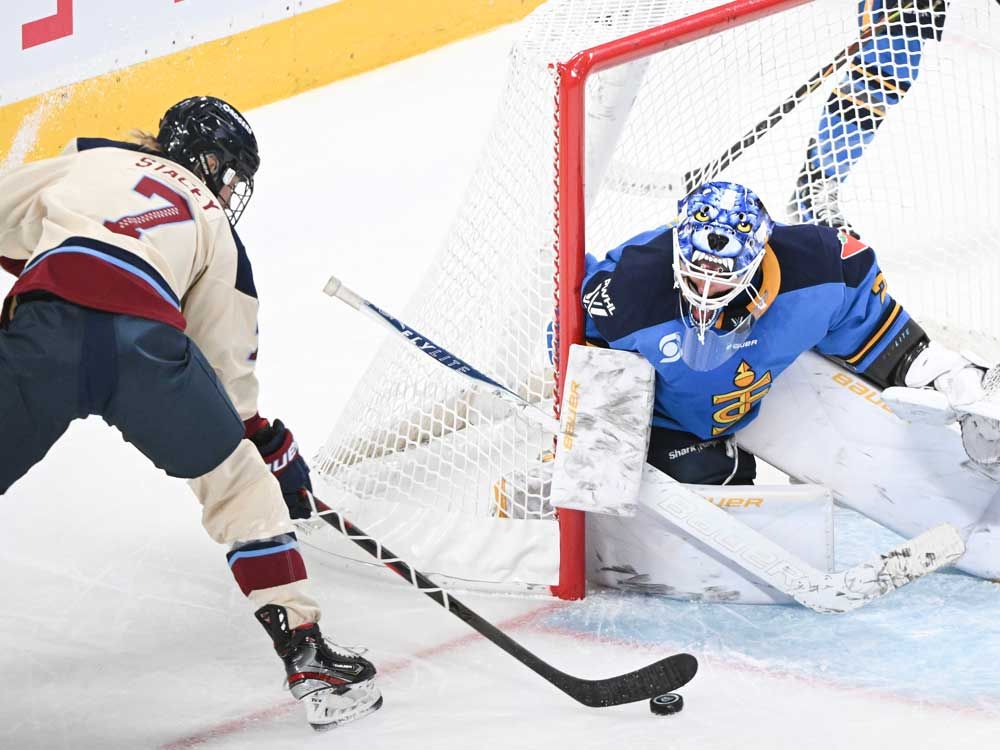 Montreal Victoire's Laura Stacey (7) moves in on Toronto Sceptres goaltender Elaine Chuli (29) during first period PWHL hockey action at the Bell Centre in Montreal, Saturday, Dec. 27, 2025.
