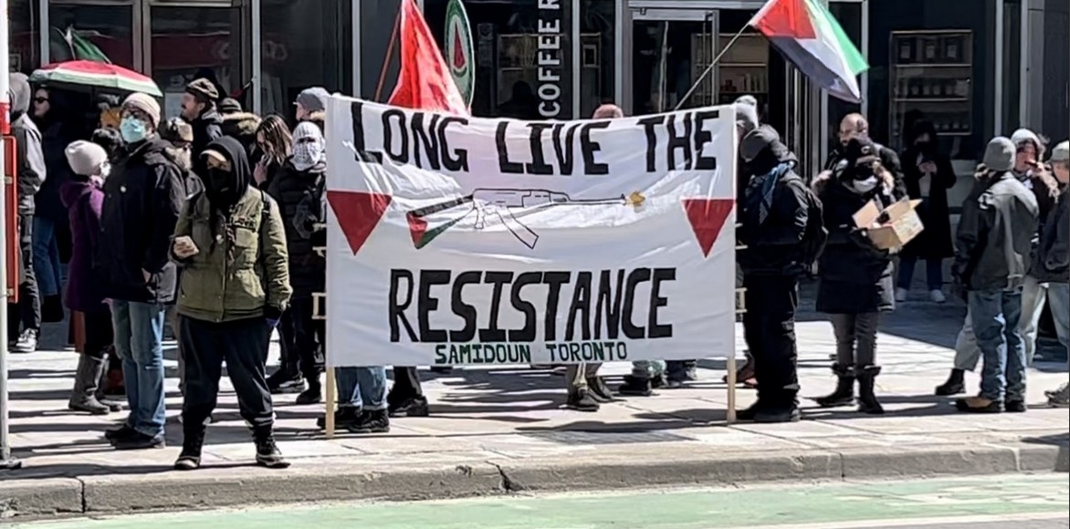  This photograph shows sign festooned with a gun and the words, “long live the resistance.” While this kind of slogan is commonplace, after what happened in Australia with the slaughter on the beach, such local threats will have to be taken more seriously — Caryma Sa’d photo