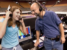 Former voice of teh Toronto Raptors Chuck Swirsky shares a laugh with Courtney Triano, daughter of former assistant coach Jay Triano in 2004.
