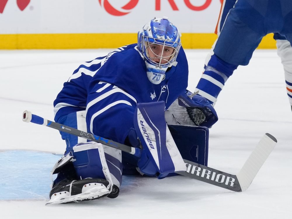 Artur Akhtyamov of the Toronto Maple Leafs makes a pad save against the Edmonton Oilers during a game in December 2025. 