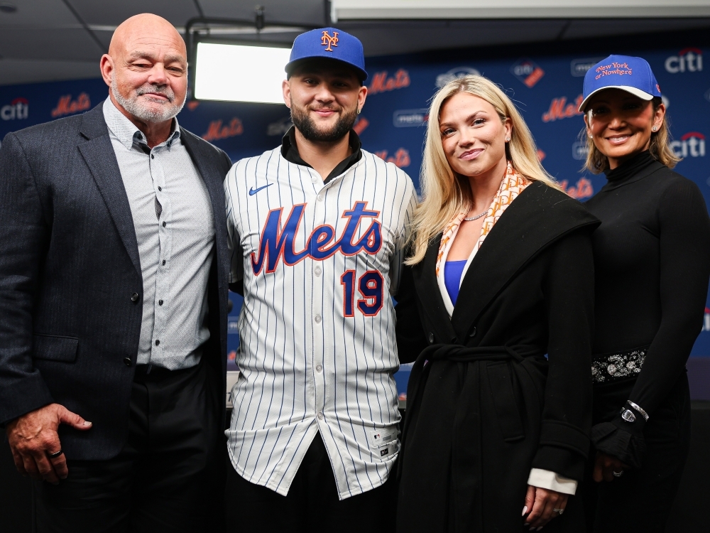 Bo Bichette of the New York Mets poses for a photo with his family during an introductory press conference.