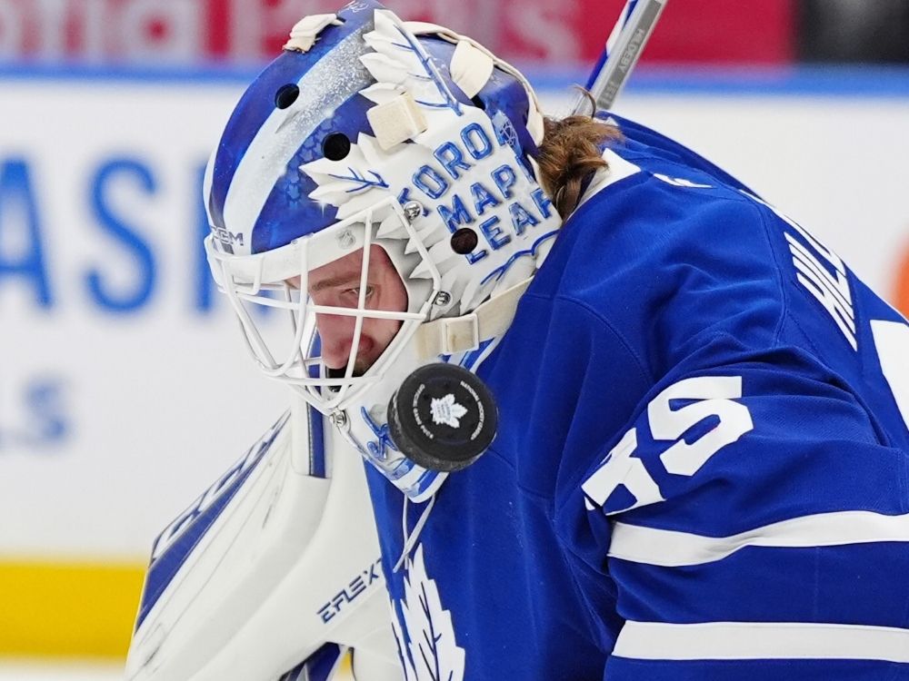 Toronto Maple Leafs goaltender Dennis Hildeby makes a save on a high shot during a game against the Montréal Canadiens earlier this season.