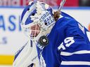 Toronto Maple Leafs goaltender Dennis Hildeby makes a save on a high shot during a game against the Montréal Canadiens earlier this season.
