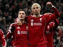 Liverpool's Florian Wirtz (left) celebrates scoring a goal with Hugo Ekitike during the UEFA Champions League football match against Qarabag.