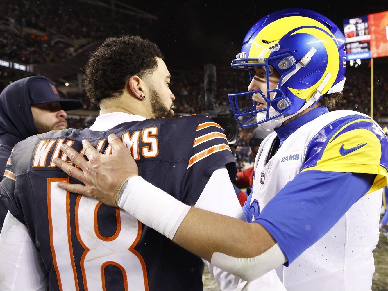 Caleb Williams of the Chicago Bears and Matthew Stafford of the Los Angeles Rams embrace.