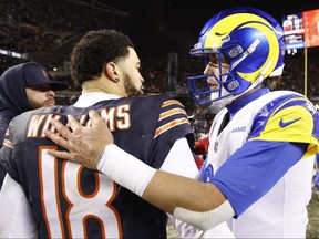Caleb Williams of the Chicago Bears and Matthew Stafford of the Los Angeles Rams embrace.