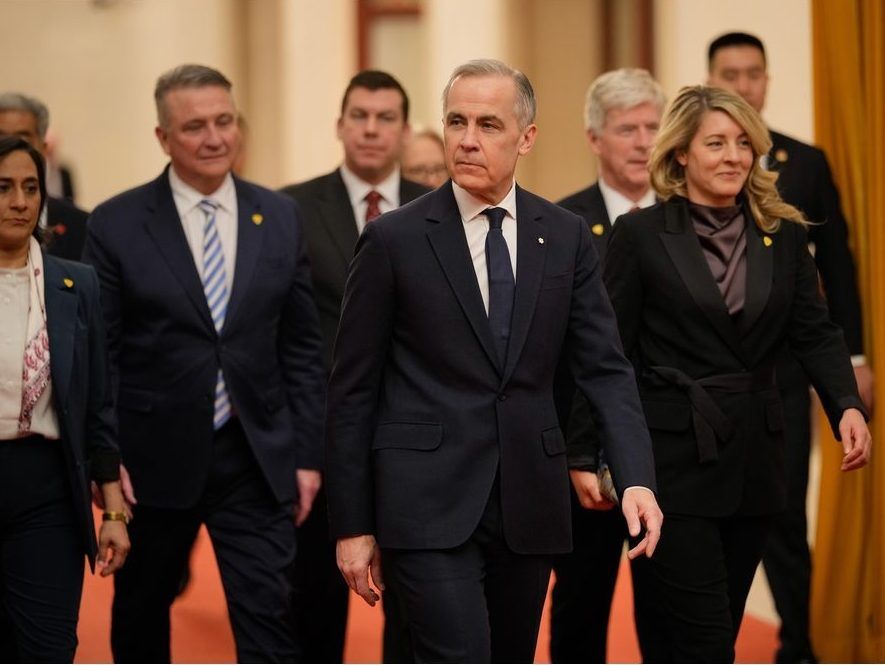 Prime Minister Mark Carney, centre, arrives to meet with Chinese President Xi Jinping, at the Great Hall of the People in Beijing, China, Friday, Jan. 16, 2026.