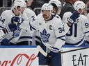 Maple Leafs captain Auston Matthews high-fives teammates after scoring a goal during the second period against the New York Islanders, Saturday, Jan. 3, 2026, in Elmont, N.Y.