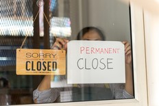 Restaurant owner posts permanent close sign.