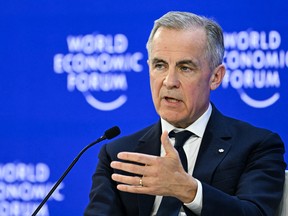 Prime Minister Mark Carney gestures as he speaks during the World Economic Forum annual meeting in Davos, Switzerland, Jan. 20, 2026.
