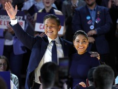 Pierre Poilievre and his wife Anaida wave to the crowd at the Conservative Party convention in Calgary, Friday, Jan. 30, 2026.