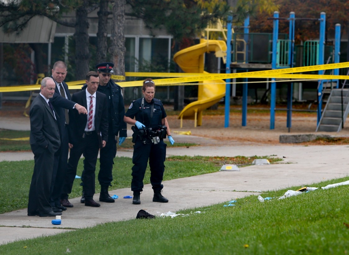  Toronto Police at the scene after Xian Xu Liu, 65, found beaten to death in a park behind Wallace Emerson Community Centre at 1260 Dufferin St. in Toronto, Ont., on Wednesday, Oct. 15, 2014.