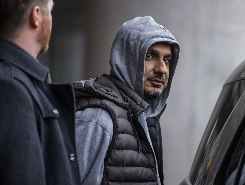 A handcuffed suspect in the 2023 Pearson International Airport gold heist - Arsalan Chaudhary - is in custody of Peel Regional Police after arriving on a flight from Dubai at Toronto Pearson International Airport on Monday, Jan. 12, 2026. 