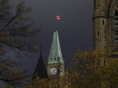 Canadian Flag flies on the Peace Tower on Parliament Hill in Ottawa on Friday, Oct. 24, 2025.