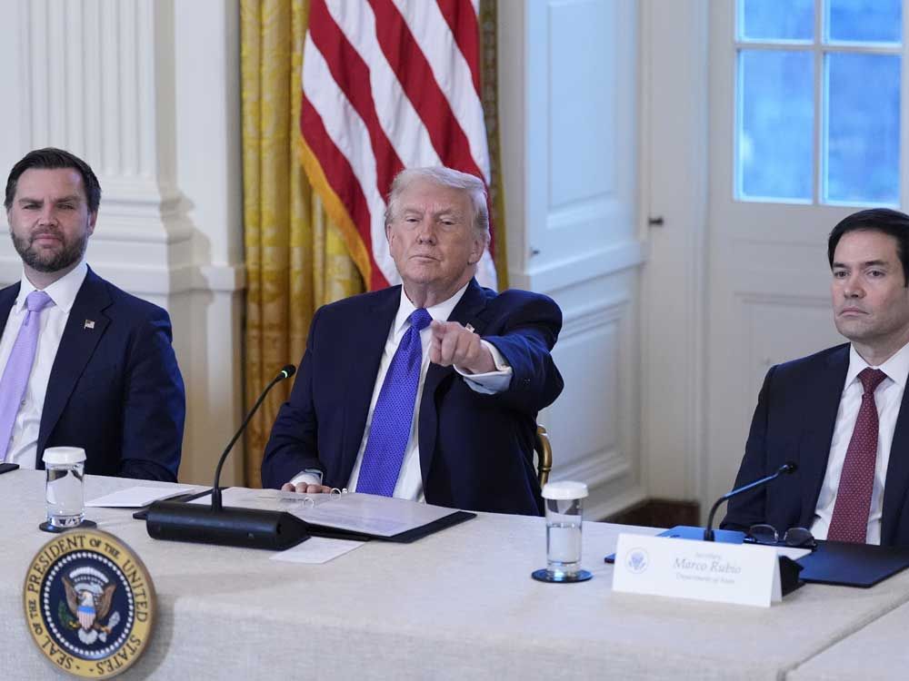 President Donald Trump chooses a reporter to ask a question with Vice President JD Vance, left, and Sec. of State Marco Rubio, right, during a meeting with oil executives in the East Room of the White House, Friday, Jan. 9, 2026, in Washington. 