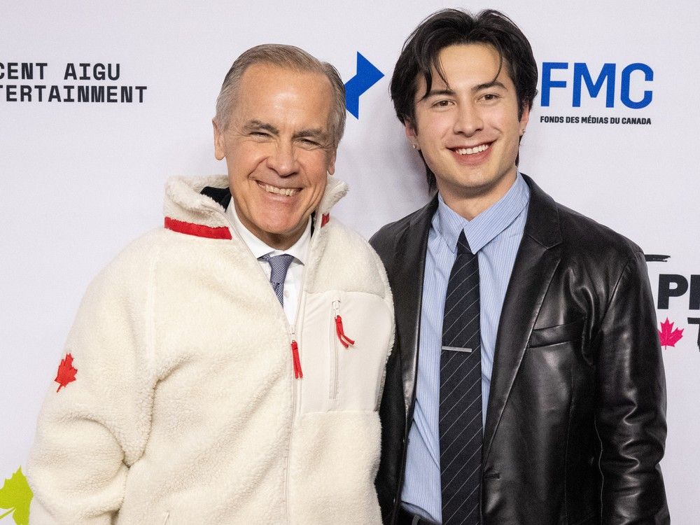 Prime Minister Mark Carney and Heated Rivalry star Hudson Williams attend the Prime Time 2026 event hosted by Canadian Media Producers Association in Ottawa on Jan. 29, 2026.
